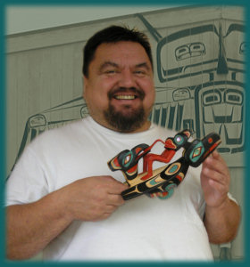 Sean holding Chief's Raven Rattle